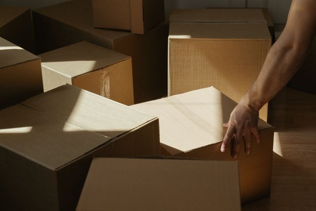 a person handling moving boxes