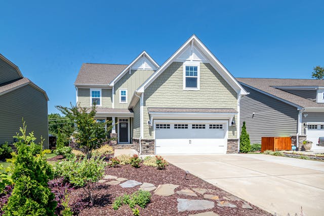 a suburban home with a landscaped yard